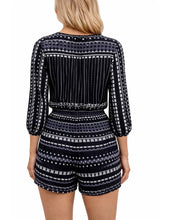 Load image into Gallery viewer, Black patterned tie up romper
