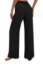 Load image into Gallery viewer, Black wide leg pants with pockets
