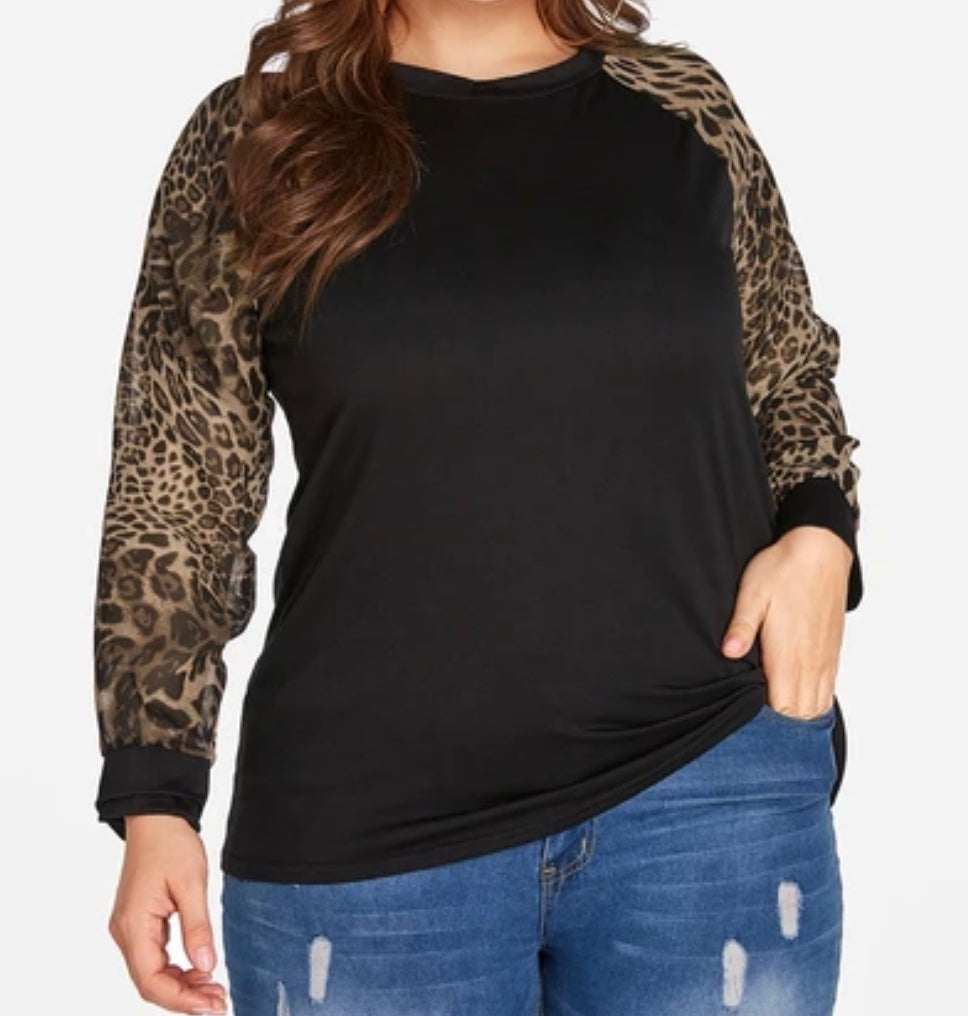 Black sweater with leopard print sleeves