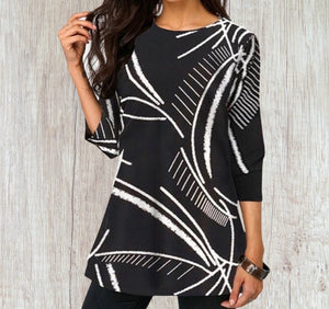 Black tunic top with white design.
