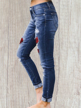 Load image into Gallery viewer, Distressed jeans with red plaid patches
