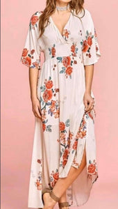 White floral maxi dress with deep v in front and back