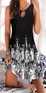 Black sleeveless print dress with cut out design