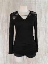 Load image into Gallery viewer, Black long sleeve top with upper floral lace and bell sleeves
