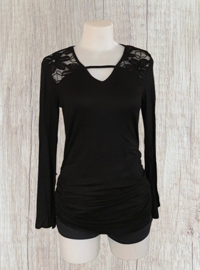 Black long sleeve top with upper floral lace and bell sleeves