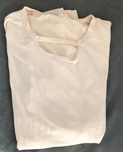 Cream colored long sleeve top
