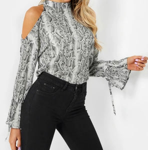 Animal print cold shoulder blouse with tie up cuffs