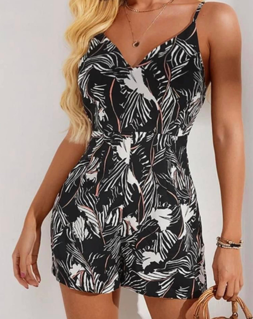 Black print romper with black zipper