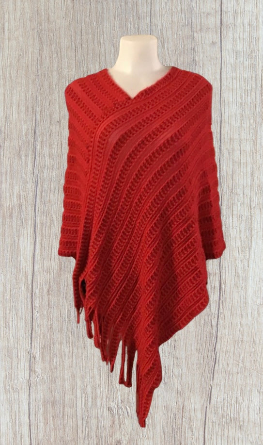 Red acrylic poncho with tassels