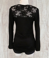 Load image into Gallery viewer, Black long sleeve top with upper floral lace and bell sleeves

