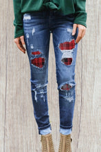 Load image into Gallery viewer, Distressed jeans with red plaid patches
