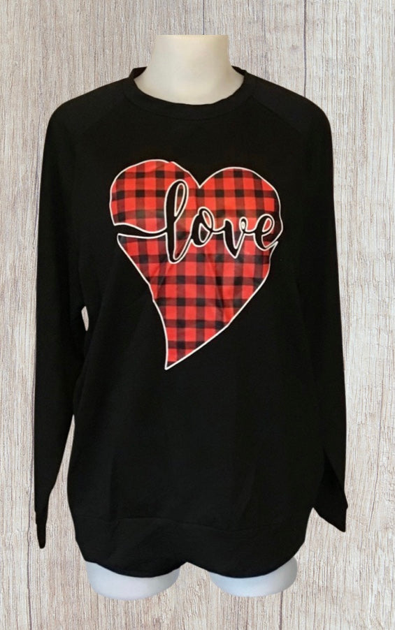 Black sweater with red plaid heart