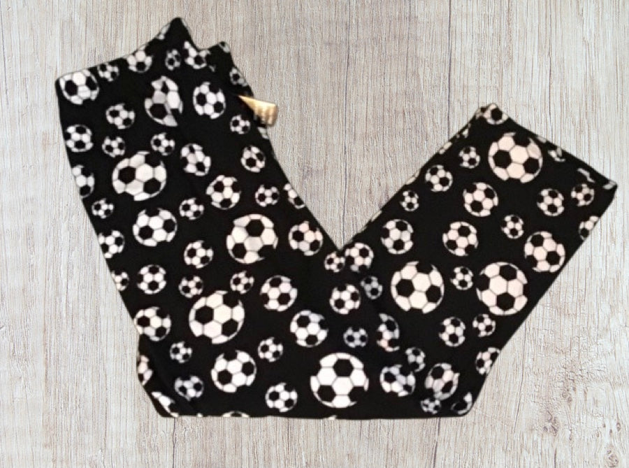 Ladies soccer print capris.