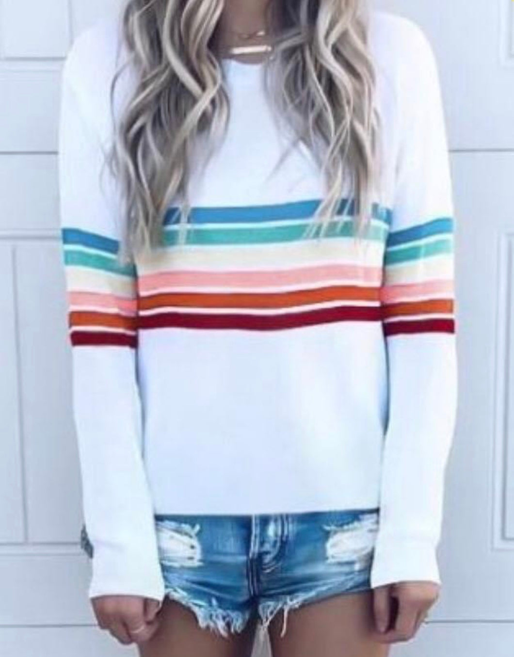 Long sleeve white striped sweater.
