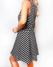 Load image into Gallery viewer, Black/white striped dress with back zipper and cut design on sides
