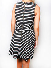 Load image into Gallery viewer, Black/white striped dress with back zipper and cut design on sides
